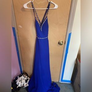 Blue beaded prom dress with a train